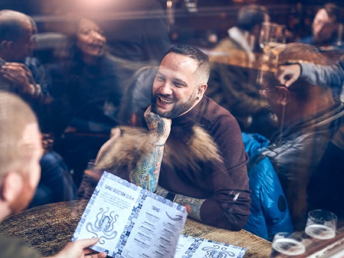Two men eating at a restaurant